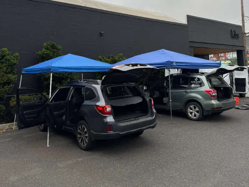Detailing two vehicles at a client's location